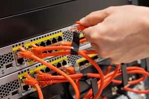 Network cabling refers to the physical infrastructure that connects devices such as computers, printers, and servers to create a network
